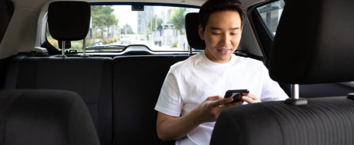 man in backseat
