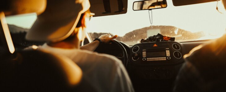 man driving car
