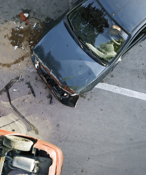 Elevated view of broken cars after accident.