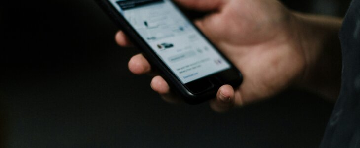 man using phone to call an uber