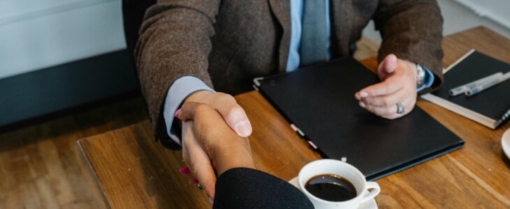 accident victim shaking hands with DC personal injury attorney