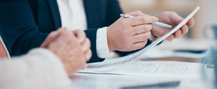 attorney reviewing settlement demand letter with client