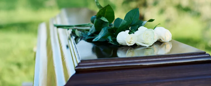Casket with flowers on them to represent a wrongful-death in Washington, DC