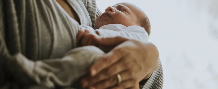Mother holding her newborn child