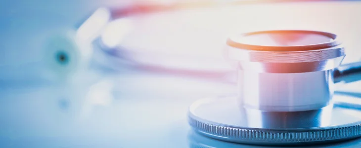 Stethoscope on table to represent medical malpractice claims in Maryland