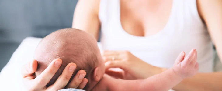 Mother and newborn baby. Baby care. Mom and child's first month of life at home. Image of happy maternity and family.