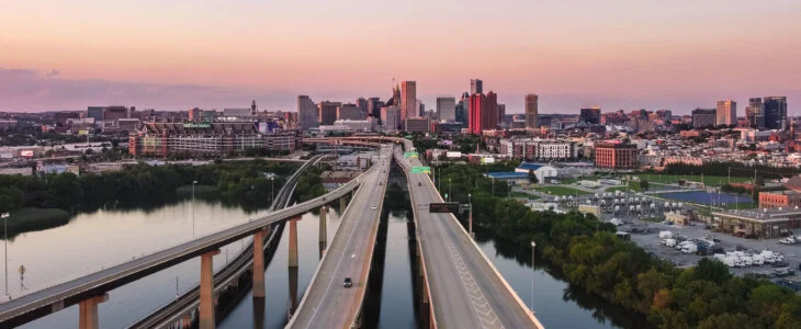 An aerial view of overlapping highways and roads over the water in downtown Baltimore, Maryland, USA