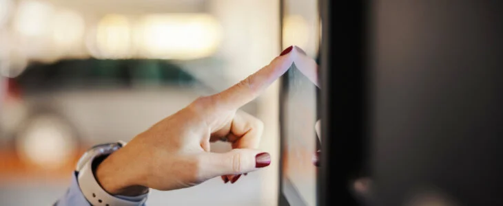 woman at D.C. courthouse touching kiosk
