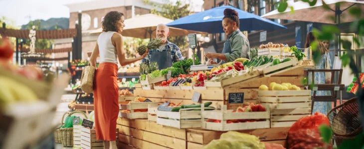 woman at summer pop-up event buying fruit